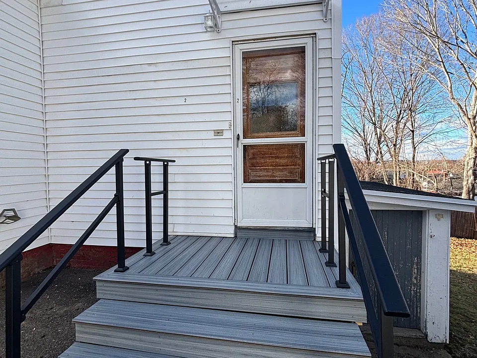 Door to Apartment, blue door to laundry in basement