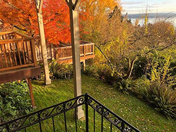 View of the back yard from the front porch of unit