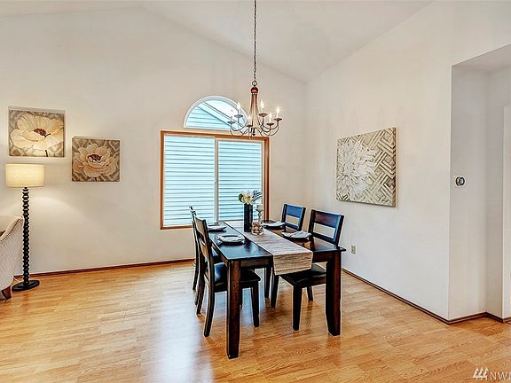 As you enter the foyer, your first view is of the spacious dining area and gorgeous vaulted ceiling. There's room for a much larger table if you need one.