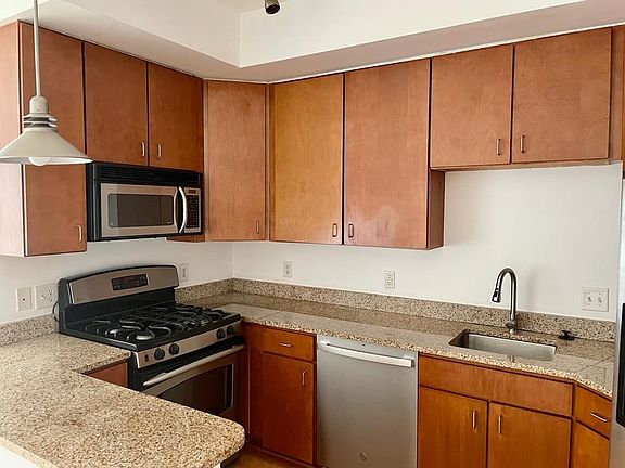 Kitchen with brand new stove and dishwasher