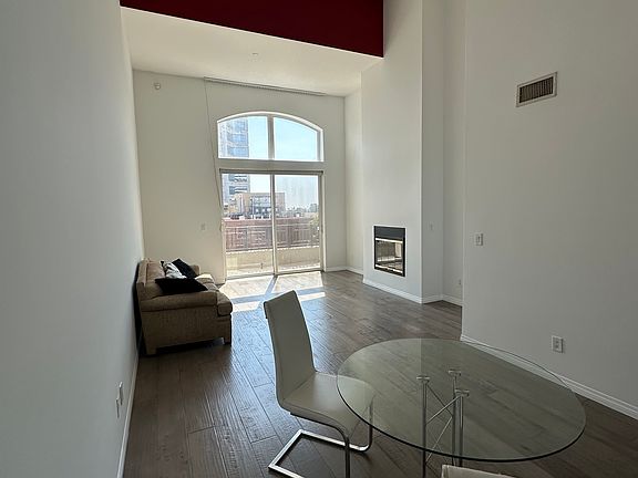 Living room w high ceiling