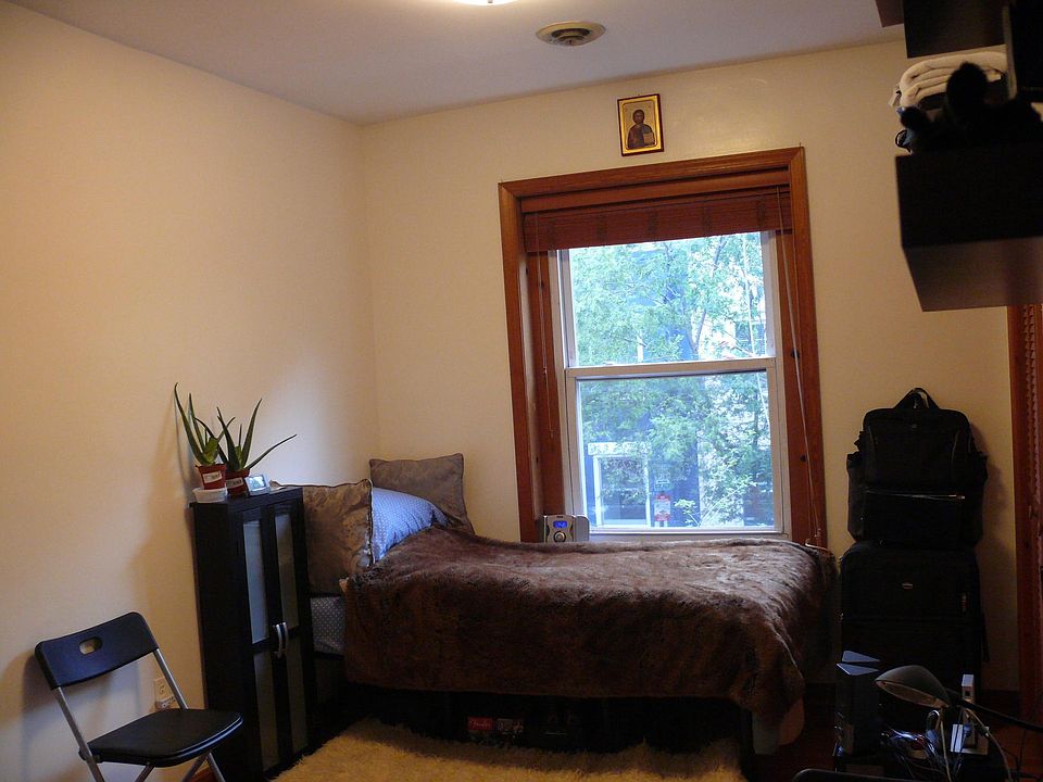 Mellow view of bed by the window
