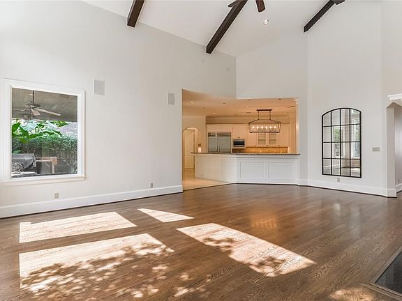 Another perspective of the Great Room with gleaming hardwood floors.
