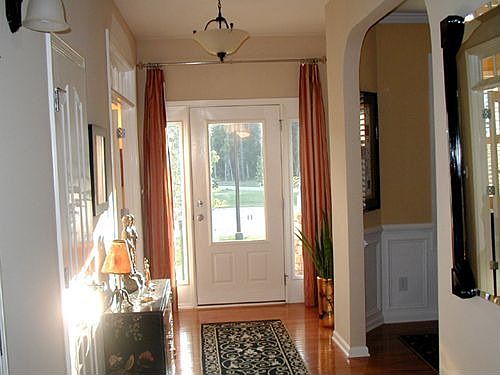 Large Foyer with hardwood floors.