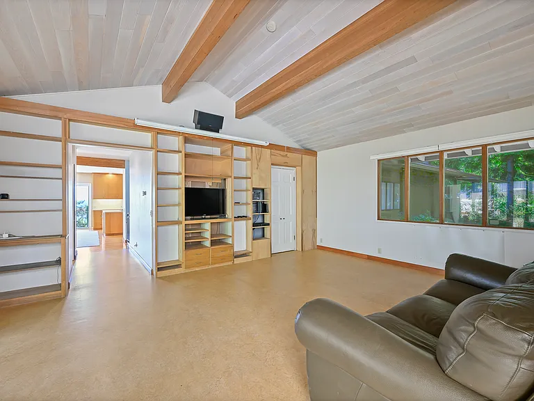 Family room with sliding doors to the side veggie garden