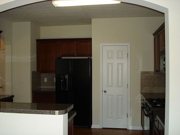 Open kitchen with lots of cabinets and newer appliances