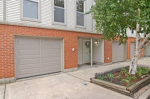 Front of unit, attached garage shown