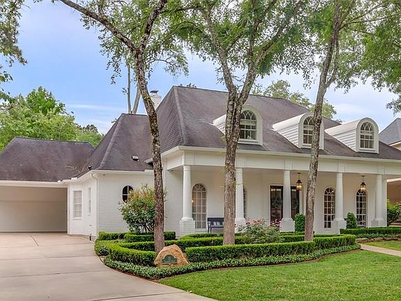 Recessed 2 car garage with 2 car porte cochere and extended driveway