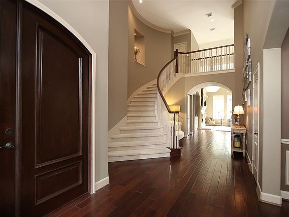 ENTRY - This view shows the custom-made arched doors leading into the study. This home has a beautiful layout.