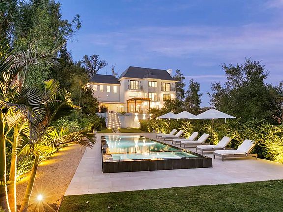 Expansive driveway leading up to this picturesque French style Chateau in Beverly Hills, California