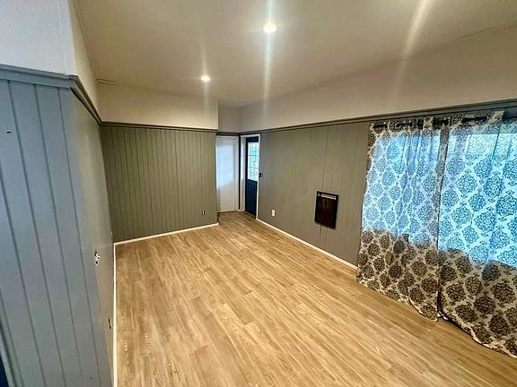 Open concept front room with extra high ceilings