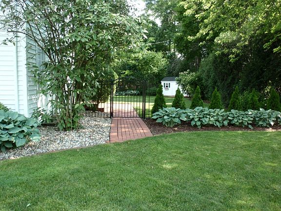 The Brick Pavers Lead to the Gated Side Entry.