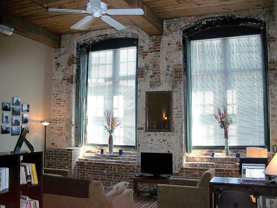 Spacious floorplan, soaring 15 foot ceilings, huge cathedral windows, exposed wooden beams.