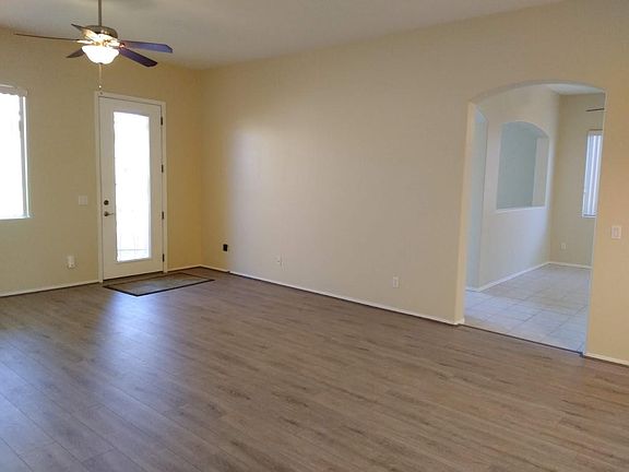 Living room and entry to kitchen and family room/den.