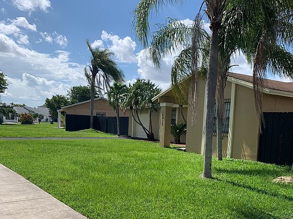 This image captures the front exterior of the subject property and is the second of five views included in the series of photographs.