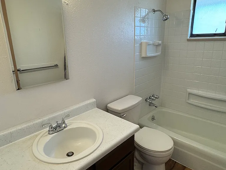 Full bath updated with new tub surround, toilet and LVP flooring.
