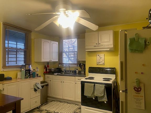 You have a Full Kitchen with counter, sink & wall cabinets, stove, refrigerator, plus built-in pantry & standing shelves behind the refrigerator