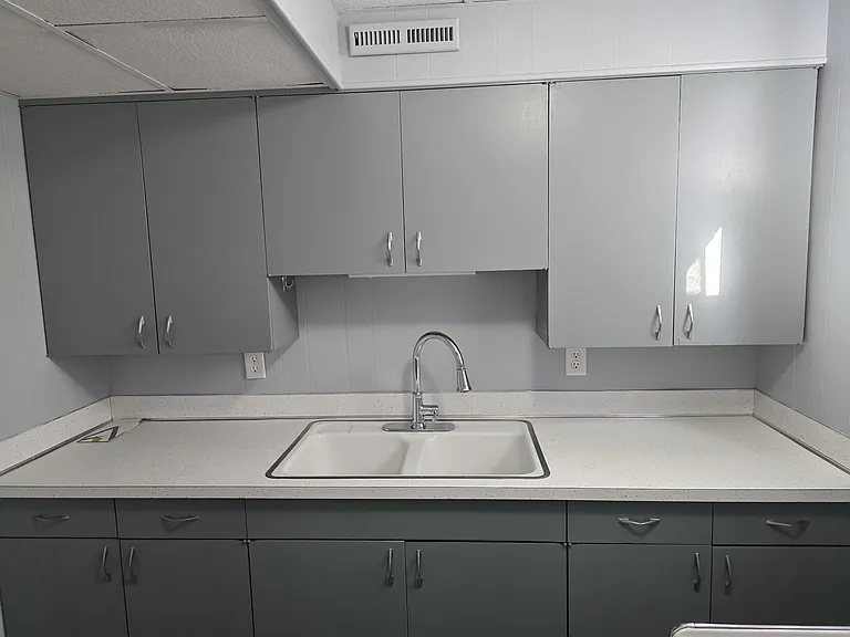 Nothing fancy, clean and simple kitchen with refrigerator and electric range