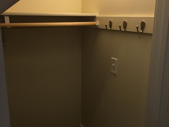 Coat closet and storage area under the stairway