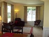 Formal Living area with Crown molding and weinscoating