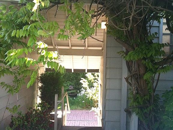 Awning connecting garage