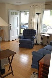 Another view of the living room, looking toward front door.