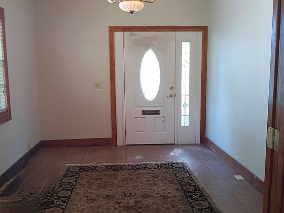large foyer tile with available oriental rug