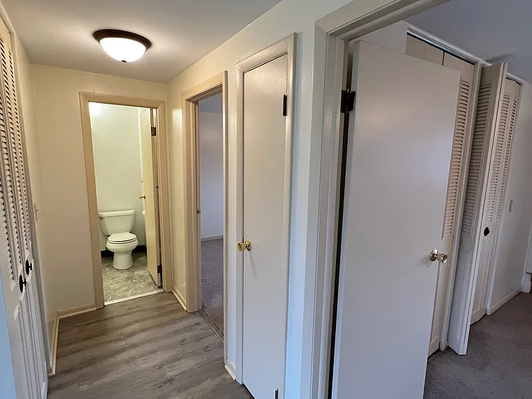 Hallway with a shot of the bathroom