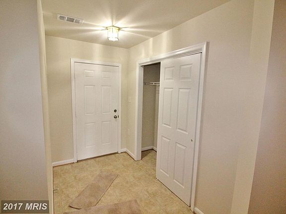 Main entrance features closets galore.