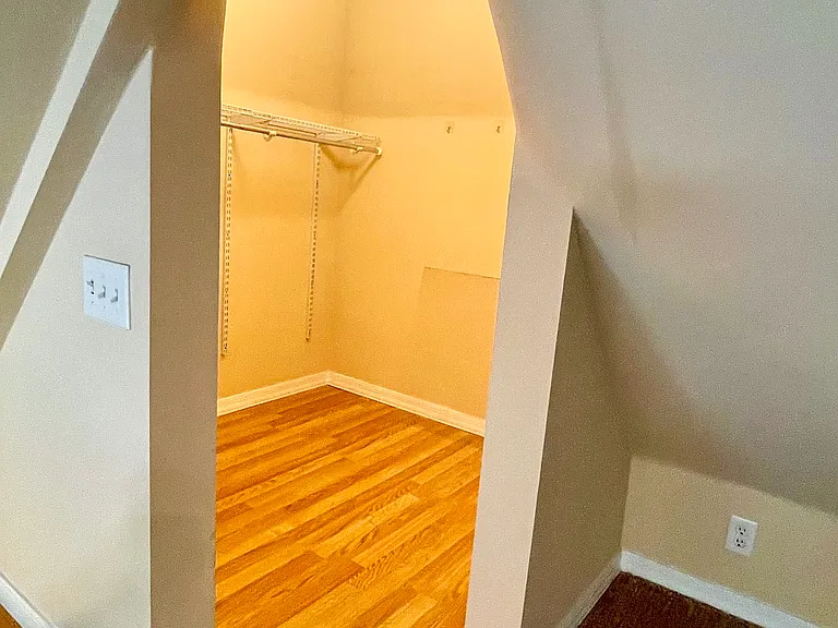 Attic walk-in closet built inside turret.