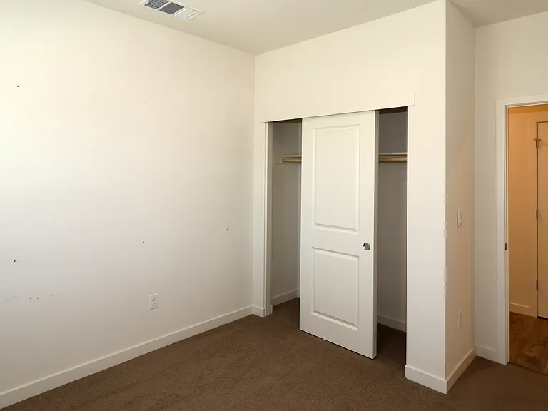 Third bedroom closet and entry.