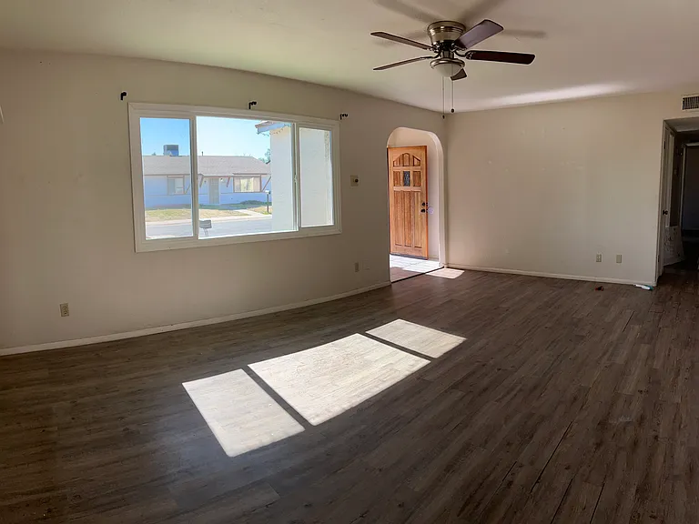 View of Living Room and Front entry from Kitchen