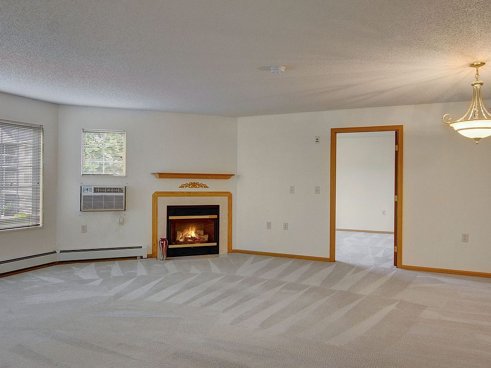 Heritage Park Living Room with Beautiful Fireplace in Select Units