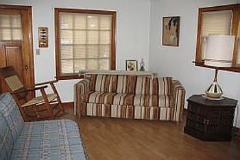 A view of the livingroom showing that beautiful pergo flooring and nice size windows, this is a 11.7