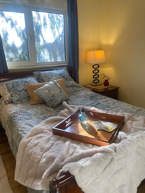 Comfortable 2nd Bedroom with Mahogany Full Bed and Matching Nightstands with 3 panel closet