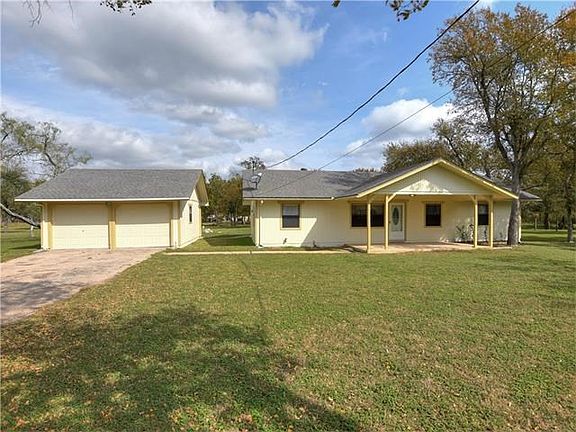 Home with 2 car detached garage.  Fresh paint.