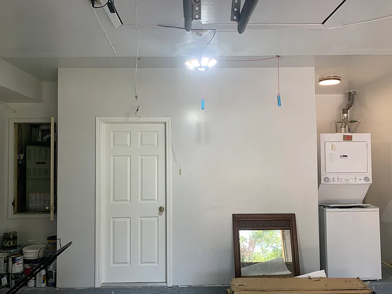 15. Garage utility area with fresh finishes. HVAC and Water Heater Downstairs in the garage; no hassles of freezing issues