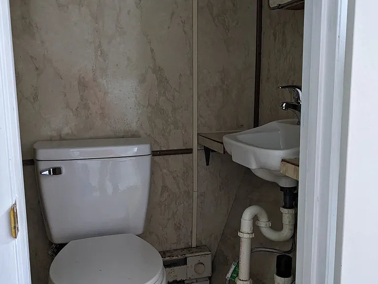 Third floor, office/playroom with a convenient half bathroom