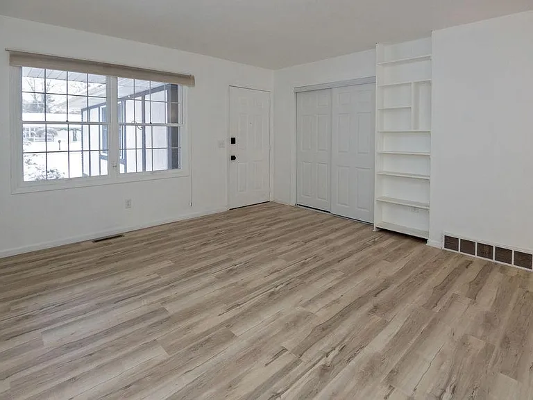 very nice front closet and built in bookshelf. Entrance from garage under covered porch