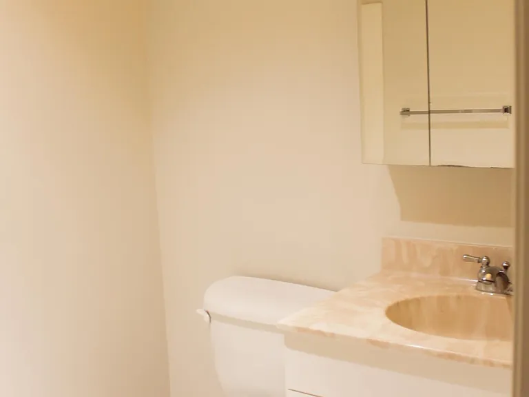 un-renovated unit, bathroom