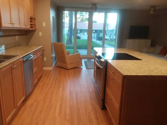 Gorgeous kitchen with upgraded wood cabinets, new appliances, granite and...view, view, view!