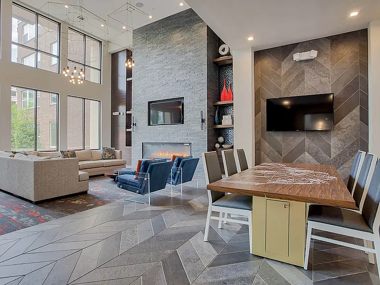 Two-story resident lounge with VIP banquette and social kitchen