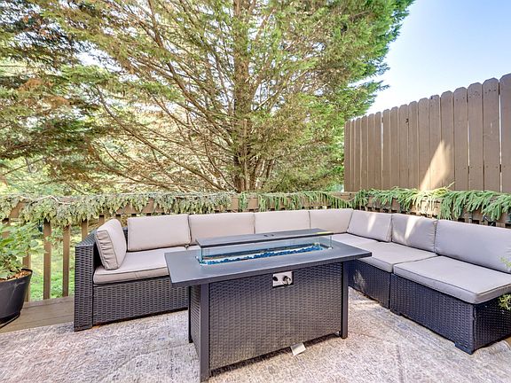 Balcony of the kitchen is outdoor sectional with fire pit