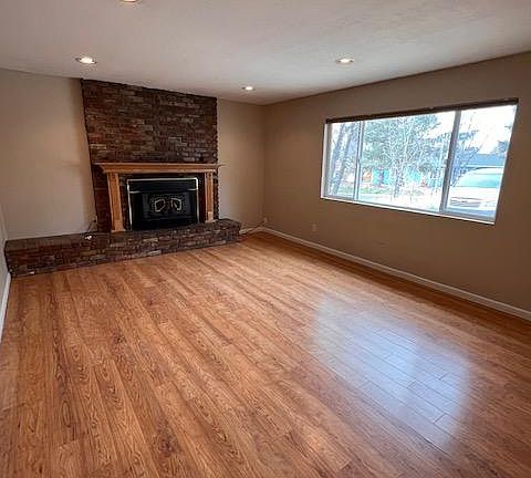 Cozy living room with wood-burning fireplace insert.
