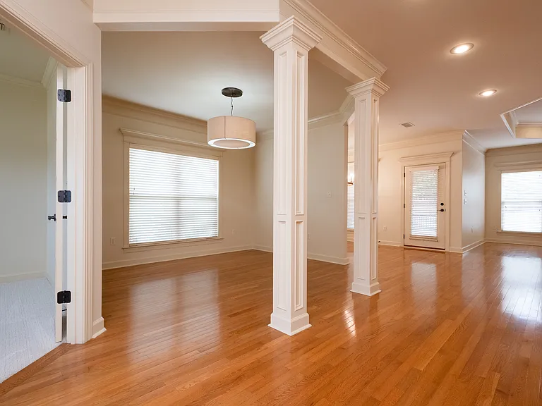 From front door. Far left is office or playroom, then a sitting room or dining room and far room on left could be a breakfast nook.
