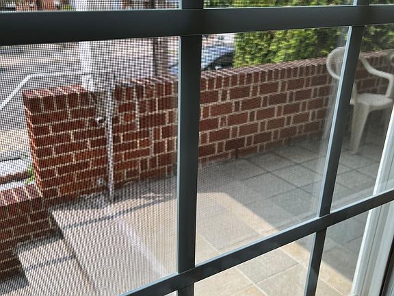 view of porch and street from living room