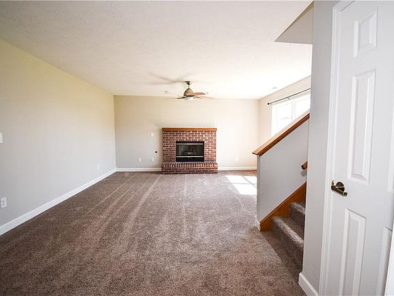 Living Room with Gas Fireplace & fresh New Carpet