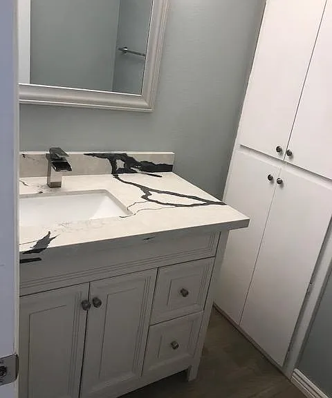 Powder room with new vanity/quartz counter