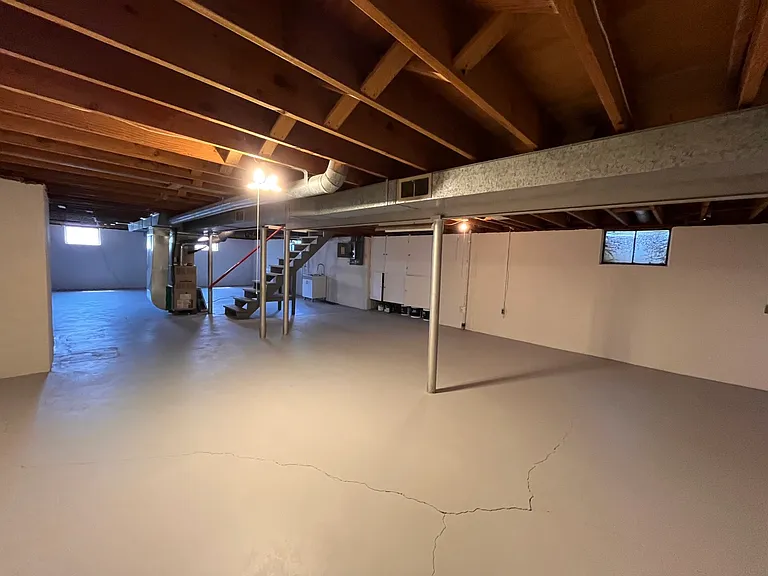 basement - painted walls and floor. Laundry hook ups available.