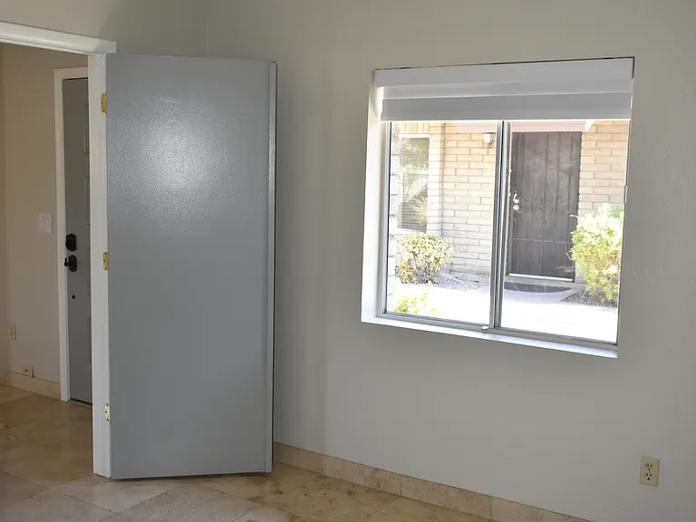 3rd Bedroom can be opened up to convert into an Office, Den, or Gameroom. Modern ceiling fan and blackout roller window shade installed Aug 2024.
